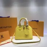 Alma-BB-Top-Handle-Satchel-in-Monogram-Vernis-Leather-M50415-Yellow-Alma-BB-Top-Handle-Satchel-in-Monogram-Vernis-Leather-M50415-Yellow-1.webp
