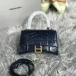 Curved-Top-Handle-Hourglass-XS-Croc-Effect-Leather-Tote-Purple-Curved-Top-Handle-Hourglass-XS-Croc-Effect-Leather-Tote-Purple-1.webp