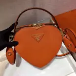 Heart-Shaped-Saffiano-Leather-Odette-Crossbody-Shoulder-Bag-1BH144-Orange-Heart-Shaped-Saffiano-Leather-Odette-Crossbody-Shoulder-Bag-1BH144-Orange-1.webp