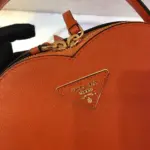Heart-Shaped-Saffiano-Leather-Odette-Crossbody-Shoulder-Bag-1BH144-Orange-Heart-Shaped-Saffiano-Leather-Odette-Crossbody-Shoulder-Bag-1BH144-Orange-2.webp