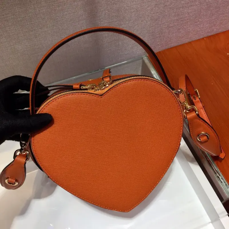 Heart-Shaped-Saffiano-Leather-Odette-Crossbody-Shoulder-Bag-1BH144-Orange-Heart-Shaped-Saffiano-Leather-Odette-Crossbody-Shoulder-Bag-1BH144-Orange-3.webp