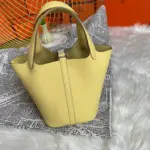Limoncello-Yellow-Lock-Bucket-Bag-in-Clemence-Leather-18-Limoncello-Yellow-Lock-Bucket-Bag-in-Clemence-Leather-18-2.webp