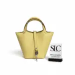 Limoncello-Yellow-Lock-Bucket-Bag-in-Clemence-Leather-Limoncello-Yellow-Lock-Bucket-Bag-in-Clemence-Leather.webp