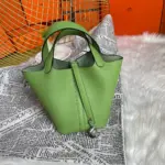 Locking-Top-Handle-Bucket-Bag-in-Green-Clemence-Leather-22-Locking-Top-Handle-Bucket-Bag-in-Green-Clemence-Leather-22-1.webp