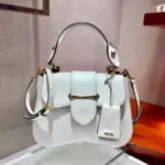 Medium-Saffiano-Leather-Sidonie-Flap-Crossbody-Bag-1BN005-White-Medium-Saffiano-Leather-Sidonie-Flap-Crossbody-Bag-1BN005-White-2.webp