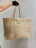 Mixed-Material-Tote-in-Re-Nylon-and-Saffiano-Leather-1BG107-Apricot-Mixed-Material-Tote-in-Re-Nylon-and-Saffiano-Leather-1BG107-Apricot-1.webp