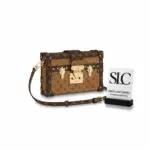 Monogram-Reverse-Canvas-Petite-Trunk-Style-Crossbody-Bag-M44154-1.webp