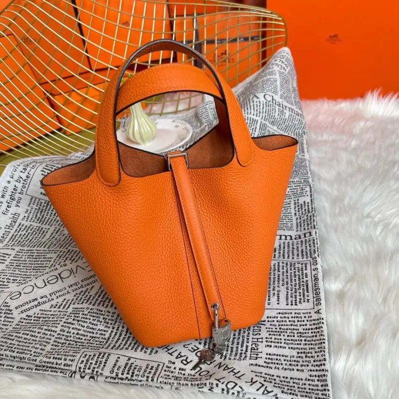 Orange-Lock-Top-Handle-Bag-in-Clemence-Grained-Leather-18-Orange-Lock-Top-Handle-Bag-in-Clemence-Grained-Leather-18-1.webp