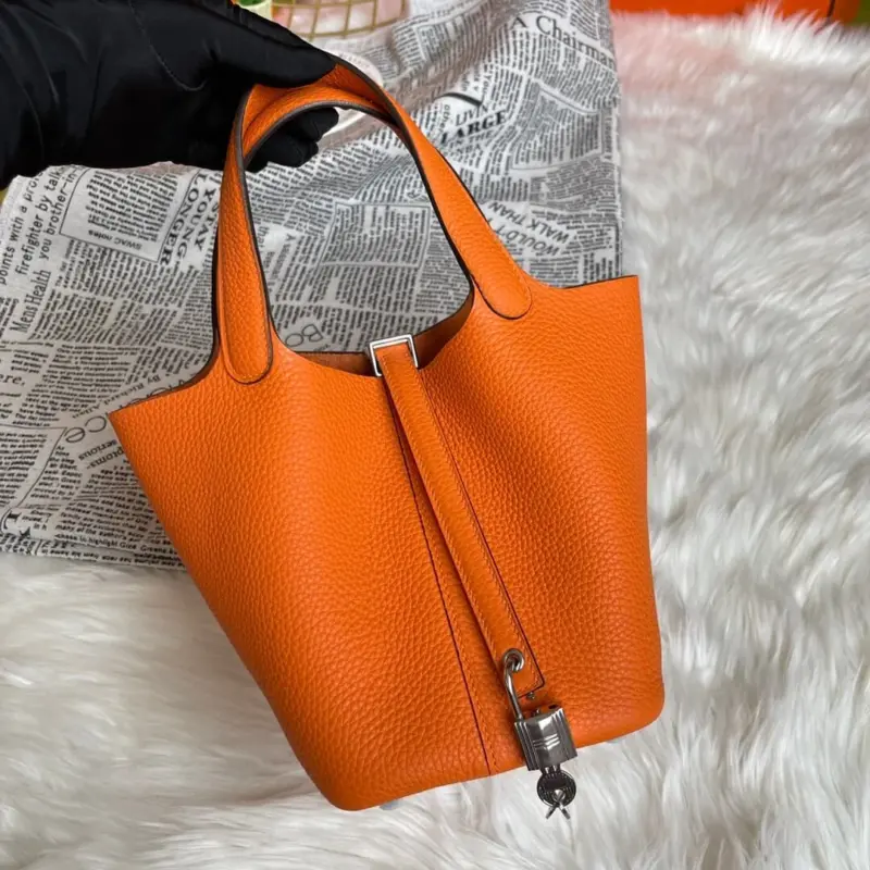 Orange-Lock-Top-Handle-Bag-in-Clemence-Grained-Leather-18-Orange-Lock-Top-Handle-Bag-in-Clemence-Grained-Leather-18-3.webp