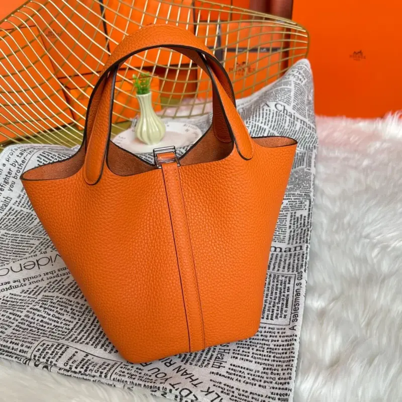 Orange-Lock-Top-Handle-Bag-in-Clemence-Grained-Leather-22-Orange-Lock-Top-Handle-Bag-in-Clemence-Grained-Leather-22-2.webp