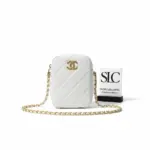 Quilted-Mini-Camera-Crossbody-in-Iridescent-Grained-Calfskin-AS2857-Quilted-Mini-Camera-Crossbody-in-Iridescent-Grained-Calfskin-AS2857.webp