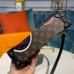 Reverse-Monogram-Kabuki-Print-Petite-Malle-Clutch-Bag-M53544-5.webp
