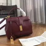 Small-16-Top-Handle-Bag-in-Satinated-Calfskin-188003-Burgundy-Small-16-Top-Handle-Bag-in-Satinated-Calfskin-188003-Burgundy-3.webp