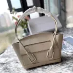 Small-Arco-Top-Handle-Tote-in-Grainy-Woven-Calfskin-580725-White-Small-Arco-Top-Handle-Tote-in-Grainy-Woven-Calfskin-580725-White-1.webp