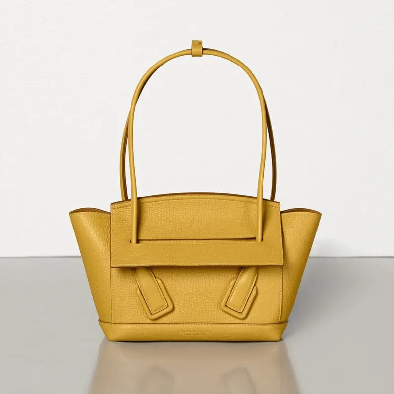 Small-Arco-Top-Handle-Tote-in-Grainy-Woven-Calfskin-580725-Yellow-Small-Arco-Top-Handle-Tote-in-Grainy-Woven-Calfskin-580725-Yellow-1.webp
