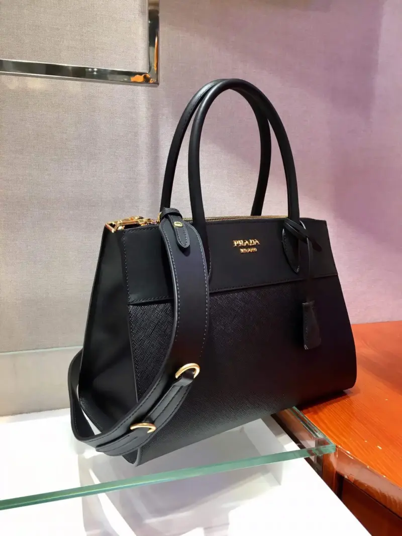 Structured-Paradigme-Top-Handle-Bag-in-Saffiano-Leather-1BA102-1-Black-Structured-Paradigme-Top-Handle-Bag-in-Saffiano-Leather-1BA102-1-Black-2.webp