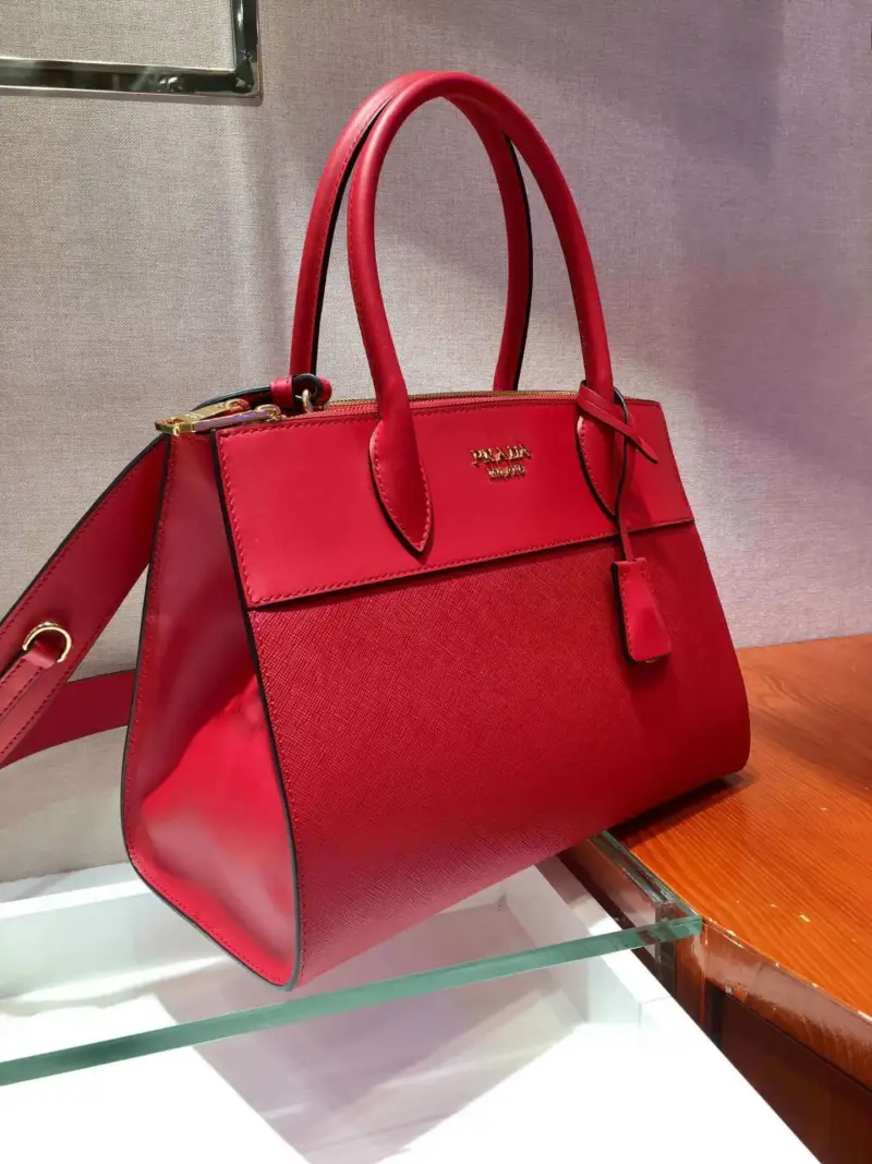 Structured-Paradigme-Top-Handle-Bag-in-Saffiano-Leather-1BA102-1-Red-Structured-Paradigme-Top-Handle-Bag-in-Saffiano-Leather-1BA102-1-Red-2.webp