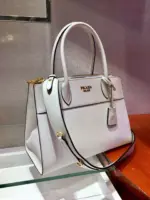 Structured-Paradigme-Top-Handle-Bag-in-Saffiano-Leather-1BA102-1-White-Structured-Paradigme-Top-Handle-Bag-in-Saffiano-Leather-1BA102-1-White-2.webp