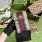 The-Hacker-Project-Coated-Canvas-Monogram-Phone-Bag-680130-Coffee-The-Hacker-Project-Coated-Canvas-Monogram-Phone-Bag-680130-Coffee-1.webp