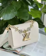 Twist-Lock-Epi-Leather-Bag-with-Monogram-Flower-Chain-White-Twist-Lock-Epi-Leather-Bag-with-Monogram-Flower-Chain-White-2.webp